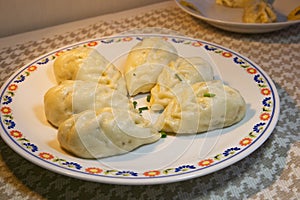 Homemade gourmet snack, Chinese steamed meat bun on table, Asian snack