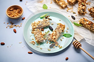 homemade granola bars with seeds and green leaf bits