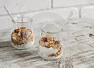 Homemade granola and natural yoghurt on a light wooden surface. Healthy food, healthy Breakfast