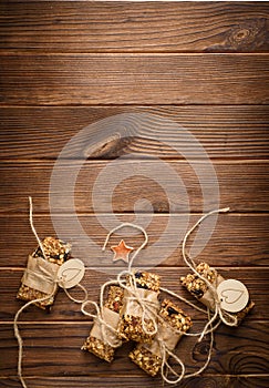 Homemade granola oatmeal energy bars, healthy snack, on wood desk wyth copy space for text