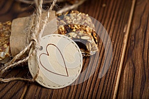 Homemade granola oatmeal energy bars, healthy snack, on wood desk wyth copy space for text