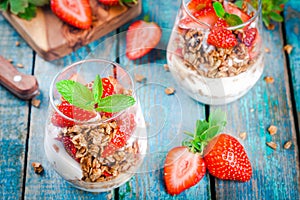 Homemade granola parfait with strawberry and mint