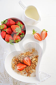 Homemade granola with strawberry on white background