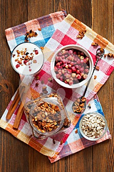 Homemade granola with wild strawberries and yogurt