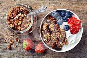 Homemade granola with yogurt and fresh berries