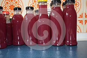homemade grape juice in reused bottles
