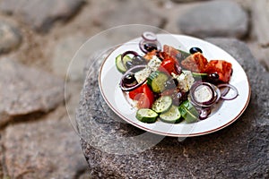 Homemade Greek salad from tomatoes, cucumbers, sweet peppers, ch