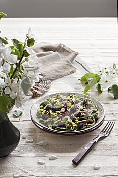 Homemade green nettle pasta with fried spring morel mushrooms