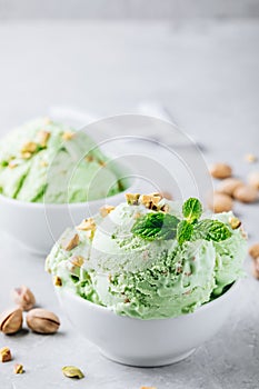 Homemade green Pistachio Ice Cream with mint leaves