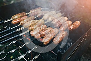 Homemade grilled sausages outdoors. Tasty food for barbecue party