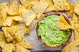 Homemade guacamole with corn chips top view