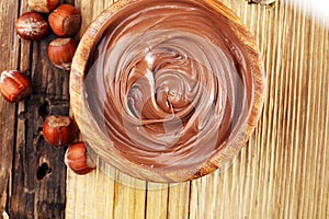 Homemade hazelnut spread in wooden bowl. Hazelnut Nougat cream