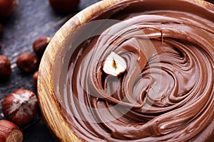 Homemade hazelnut spread in wooden bowl. Hazelnut Nougat cream photo