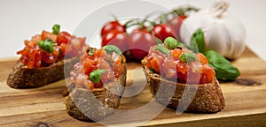 Bruschetta - sandwitch with tomatoes, basil and oliven oil