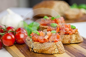Bruschetta - sandwitch with tomatoes, basil and oliven oil