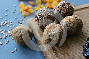 Homemade healthy raw vegan sweet balls with nuts,raisins, dates, cocoa and flax seeds. Healthy vegan food concept