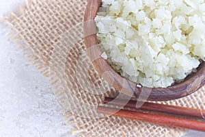 Homemade Healthy Vegetarian Cauliflower Rice in Wooden Bowl