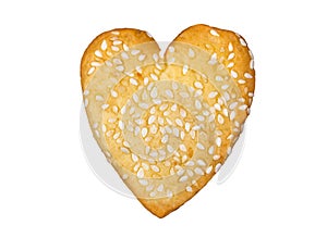 Homemade heart shaped cookie with sesame seeds baked for Valentine day 14 February isolated on white background