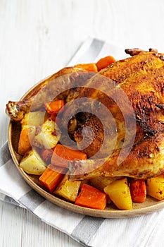 Homemade Hearty Roasted Chicken on a Plate, side view. Copy space