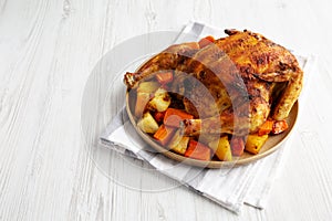 Homemade Hearty Roasted Chicken on a Plate, side view. Space for text