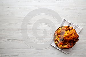 Homemade Hearty Roasted Chicken on a Plate, top view. Space for text