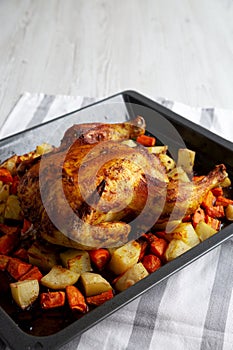 Homemade Hearty Roasted Chicken on Tray, side view. Copy space