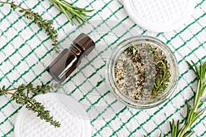 Homemade herbal scrub foot soak or bath salt with rosemary, thyme, sea salt, olive oil and essential oils.