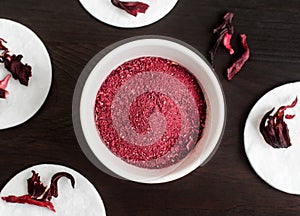 Homemade hibiscus powder for preparing face and body mask or exfoliating scrub bath salts, foot soak.