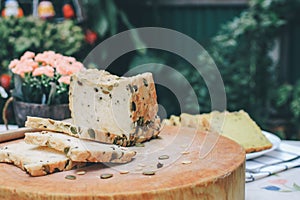 Homemade High fiber natural health food Sliced rye bread on cutting board. Whole grain rye bread with seeds