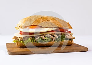 Homemade Hoagie with meat chicken egg, lettuce and Tomato. Official Sandwich of Philadelphia. National Hoagie Day concept
