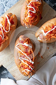 Homemade hot dogs with sausage and carrot