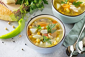 Homemade Hot Soup with Vegetables, Chicken and Peas Chickpeas. Eastern cuisine.