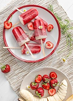 Homemade ice cream from bananas and strawberries, topview