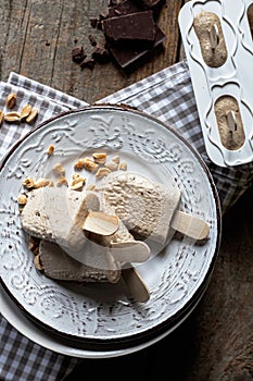 Homemade ice cream pops with peanut butter and chocolate flavor. Summer refreshment, healthy dessert. Close up