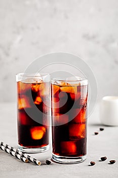 Homemade iced coffee with ice cubes in tall glasses