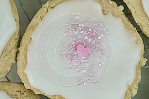 Homemade iced cookie with pink heart