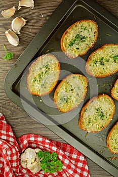 Homemade Italian Crispy Oven-Baked Garlic Bread with Olive Oil, Grated Parmesan, and Herbs