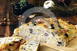 Homemade Italian Focaccia with mozzarella, hazelnut, red onion, black olive, garlic , rosemary and thyme