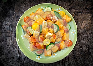 Homemade Italian gnocchi with tomato sauce and zucchini