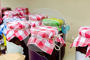 Homemade jams in glass jars for sale on country fair