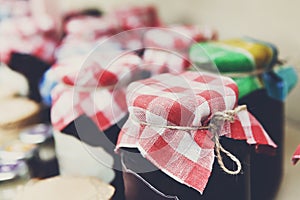 Homemade jams in glass jars for sale on country fair