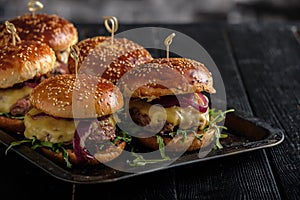 Homemade juicy burgers with beef, cheese and caramelized onions