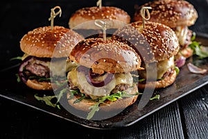 Homemade juicy burgers with beef, cheese and caramelized onions