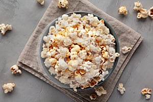 Homemade Kettle Corn Popcorn with Salt in a Bowl, top view. Flat lay, overhead, from above