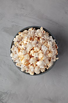 Homemade Kettle Corn Popcorn with Salt in a Bowl, top view. Flat lay, overhead, from above