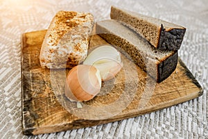 Homemade lard, bread and onions on the cutting Board. National food