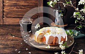 Homemade lemon bundt cake decorated with white glaze and zest