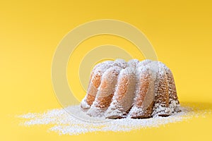 Homemade lemon bundt cake with icing sugar.