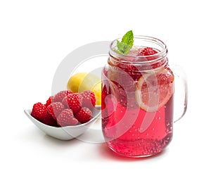 Homemade lemonade with raspberry and lemon isolated on white