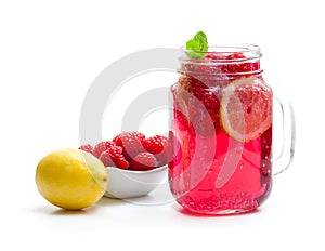 Homemade lemonade with raspberry and lemon isolated on white